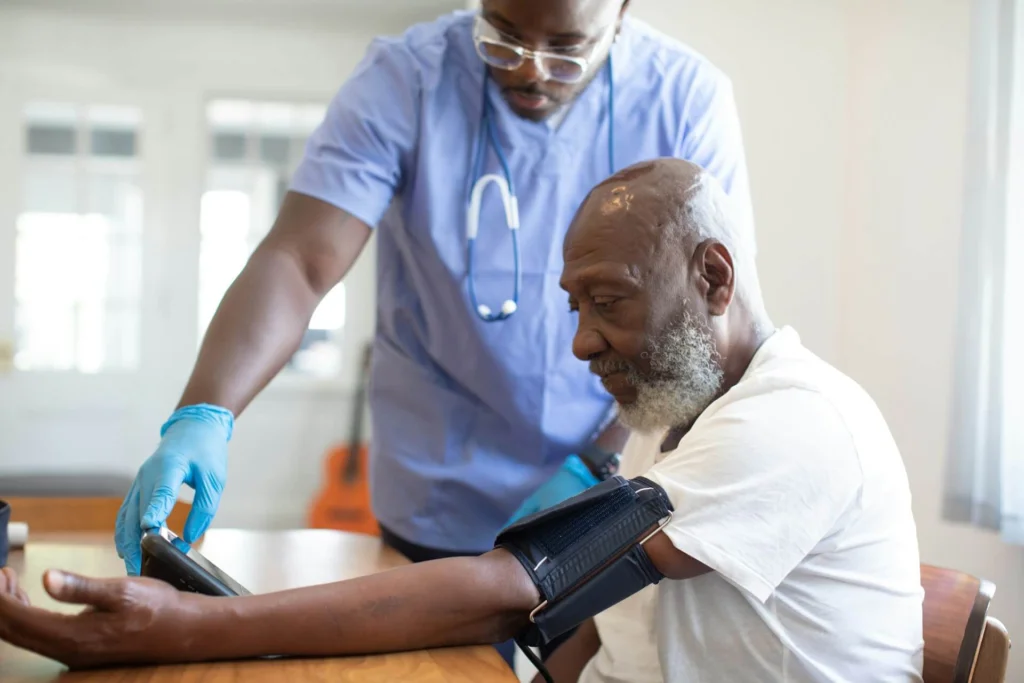 A healthcare professional measuring a patient's blood pressure