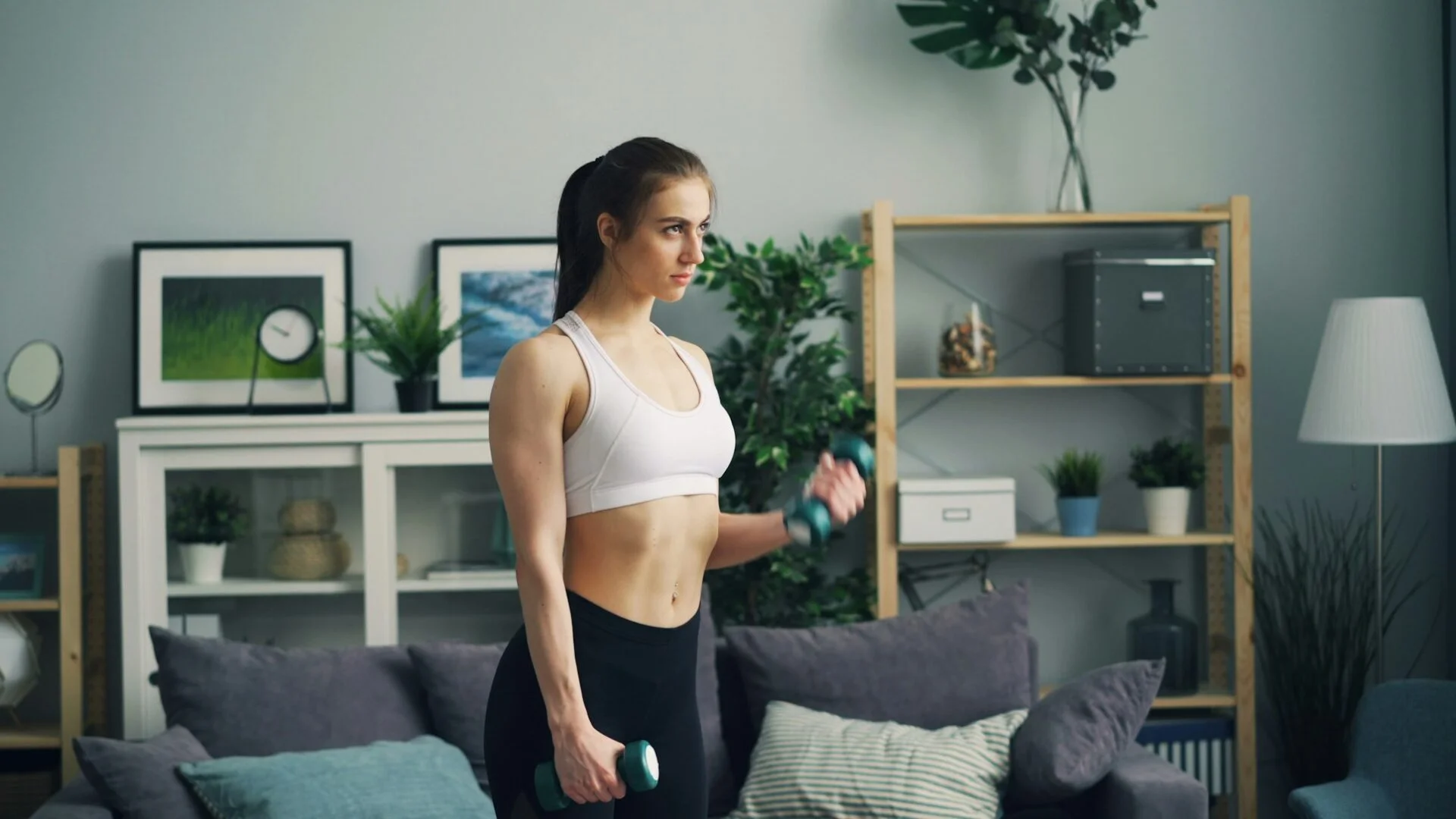 woman holding dumbbells