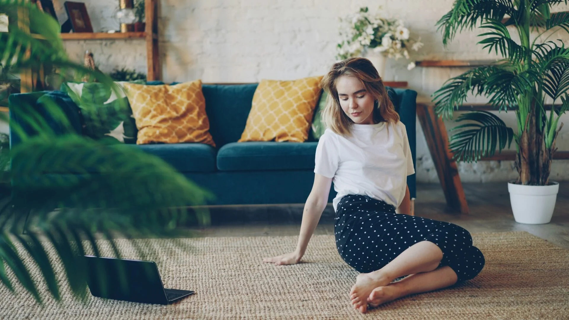 woman doing stretching exercises at home