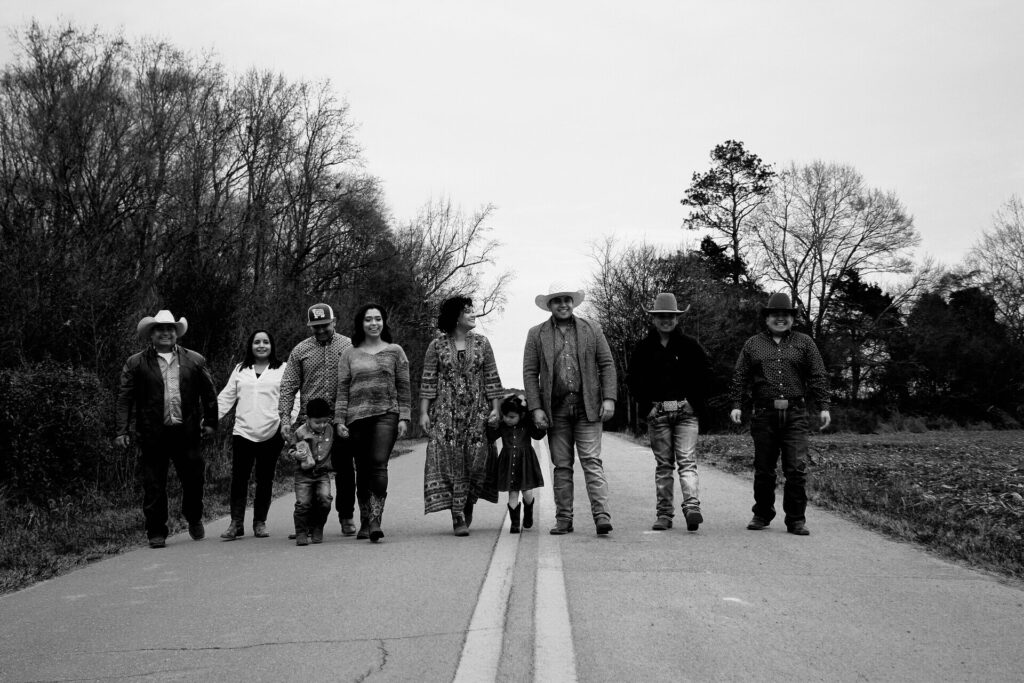 A multigenerational family walking down the street together