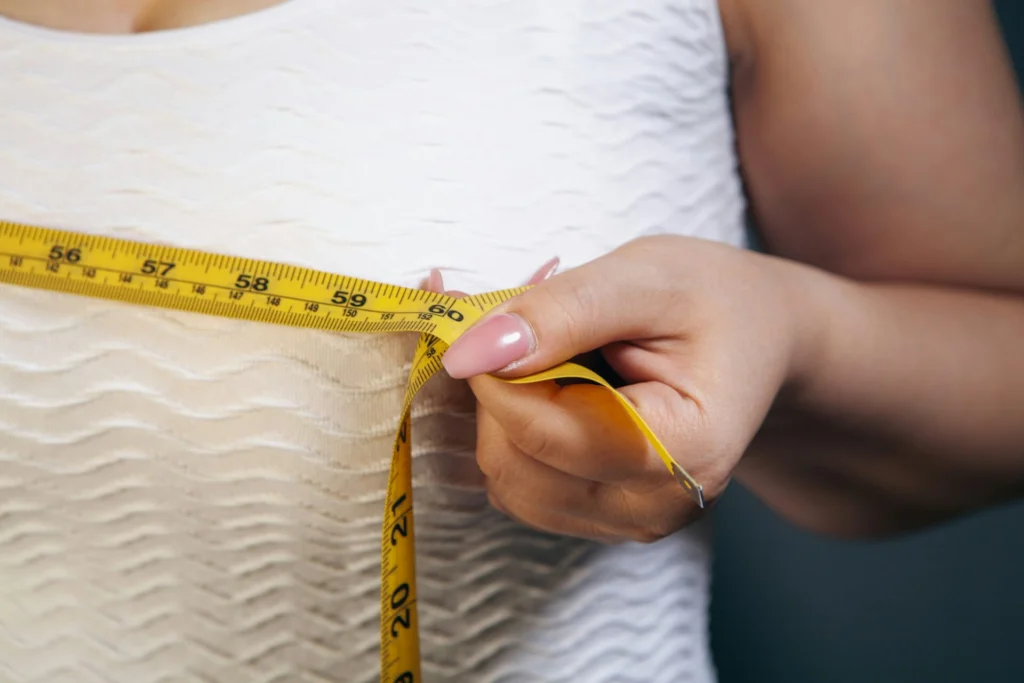 woman measuring chest
