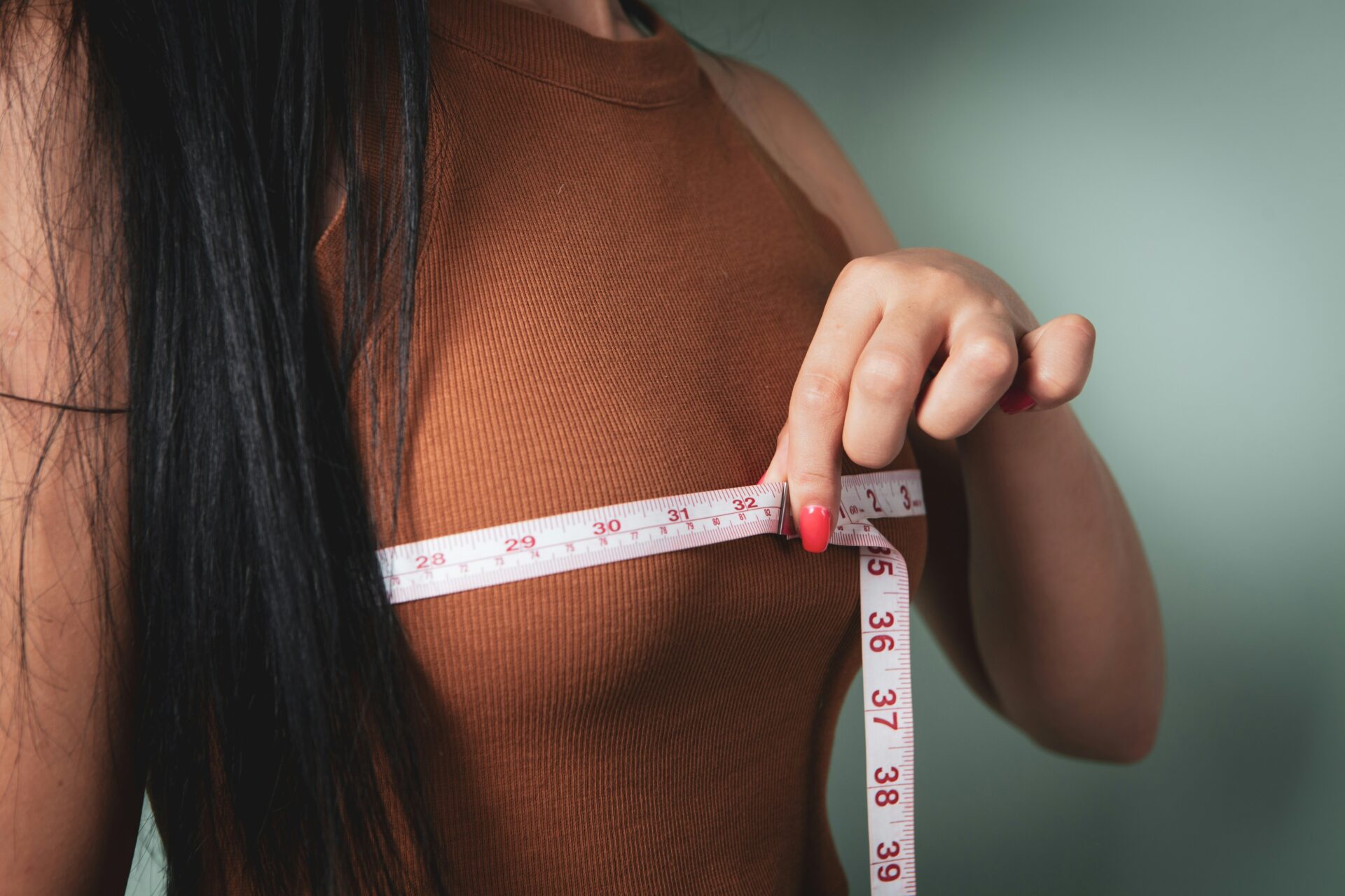 woman measuring chest