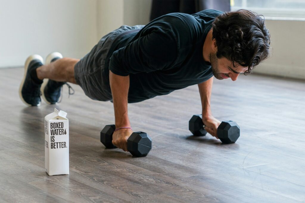 man doing weighted plank