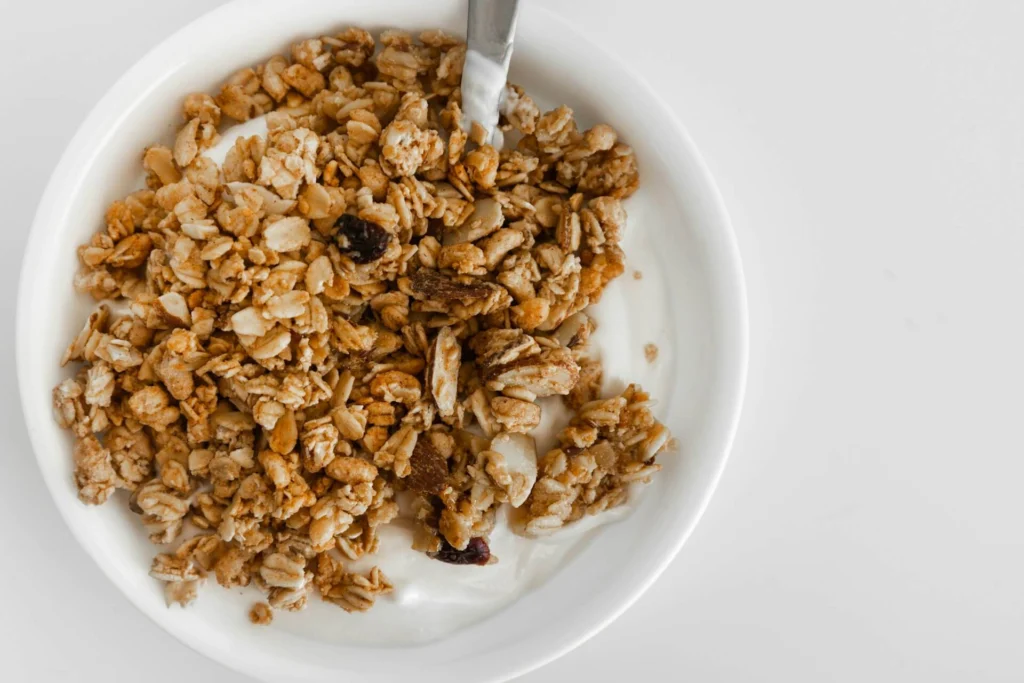 A bowl of granola with a spoon, a simple way to serve homemade kefir