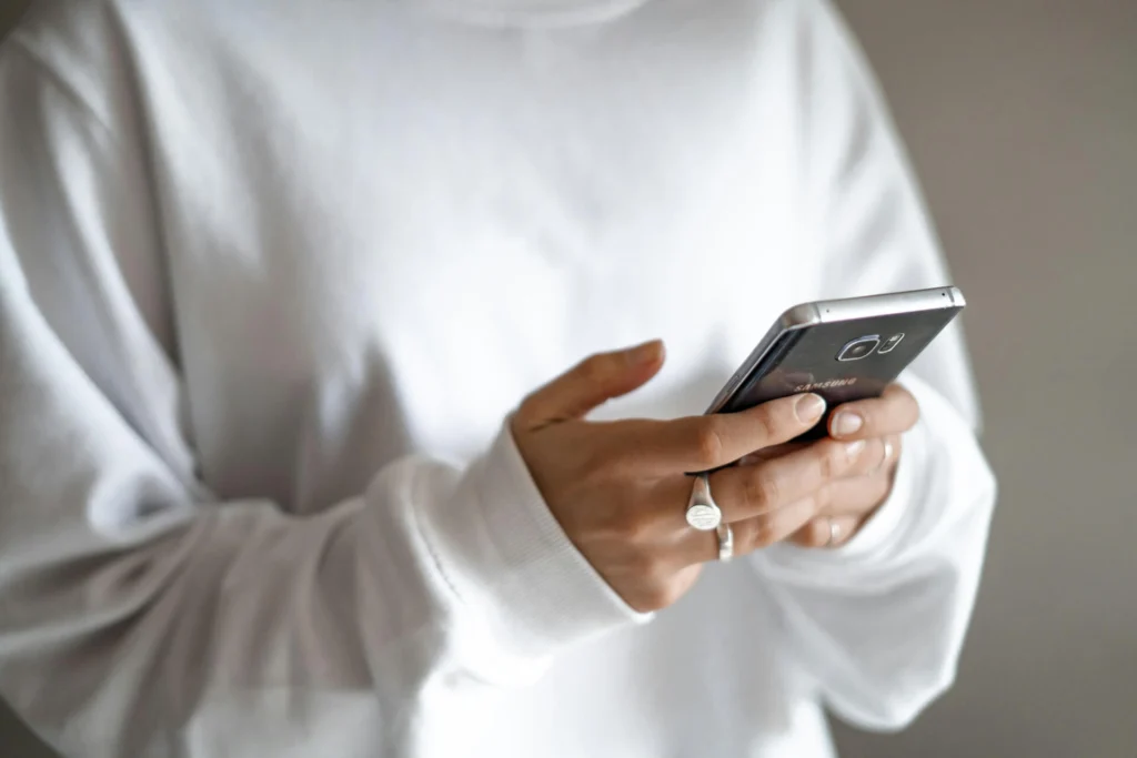 A woman scrolling on her phone