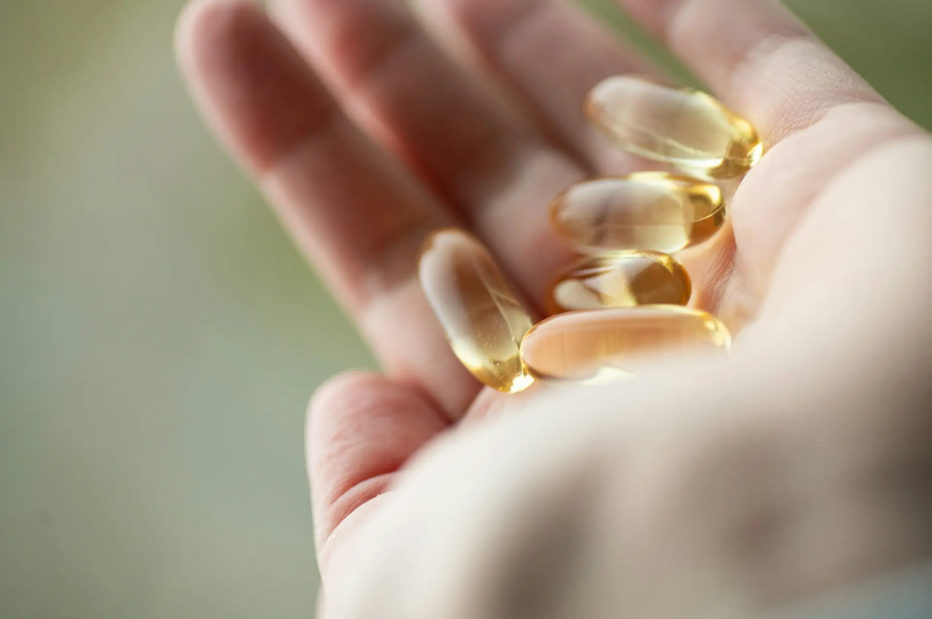 Are peptides safe? A hand holding what look like peptides supplement