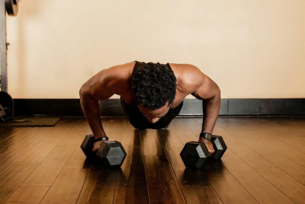man doing weighted planks