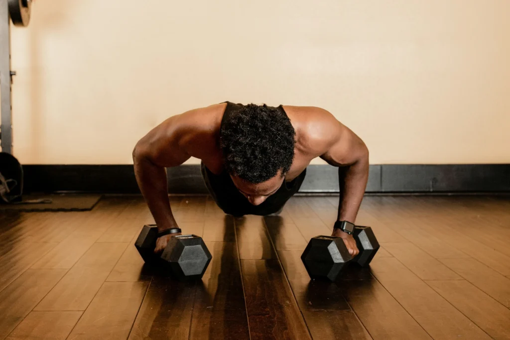 man doing weighted planks