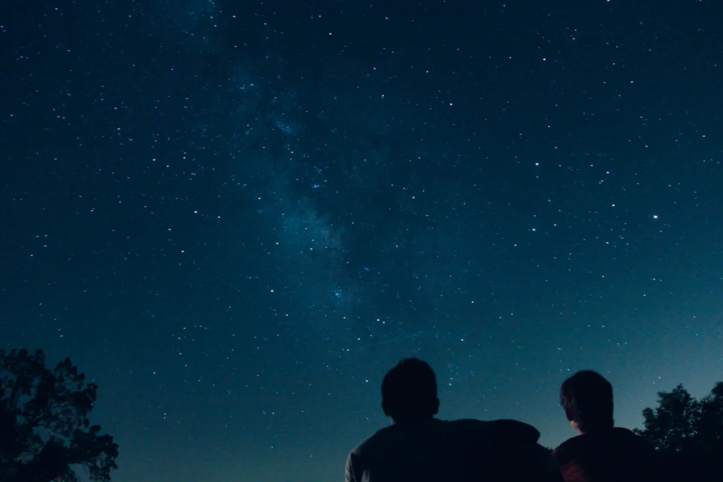 Two people under the stars
