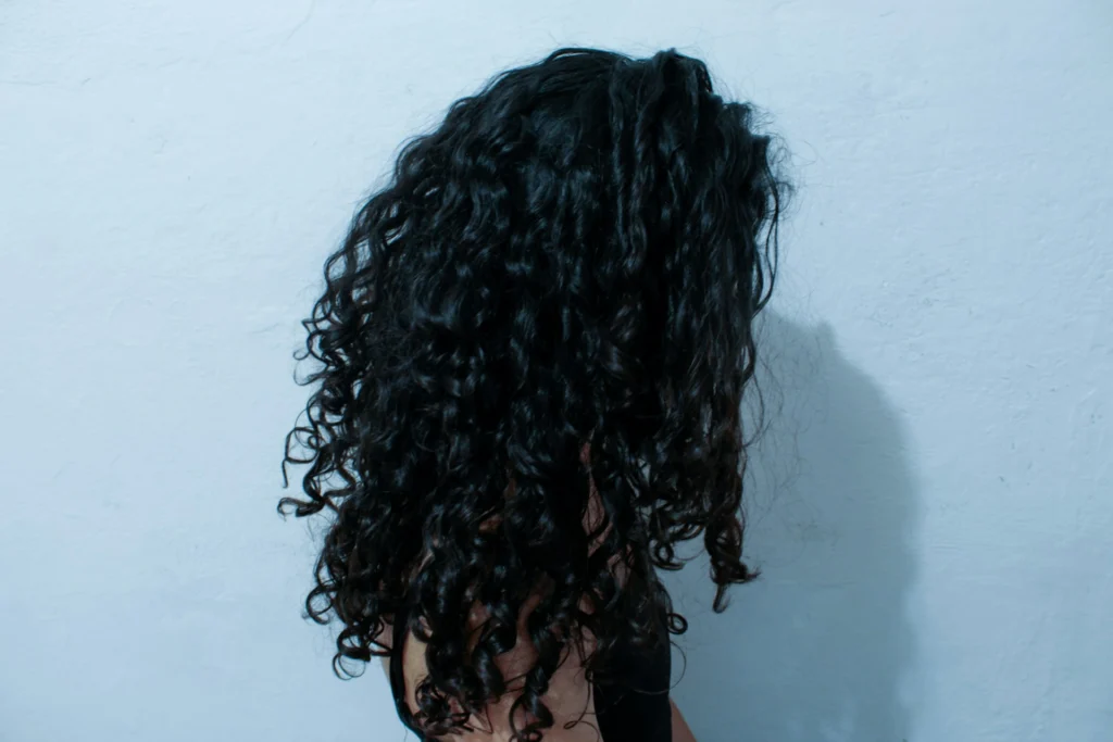 curly haired woman from the back
