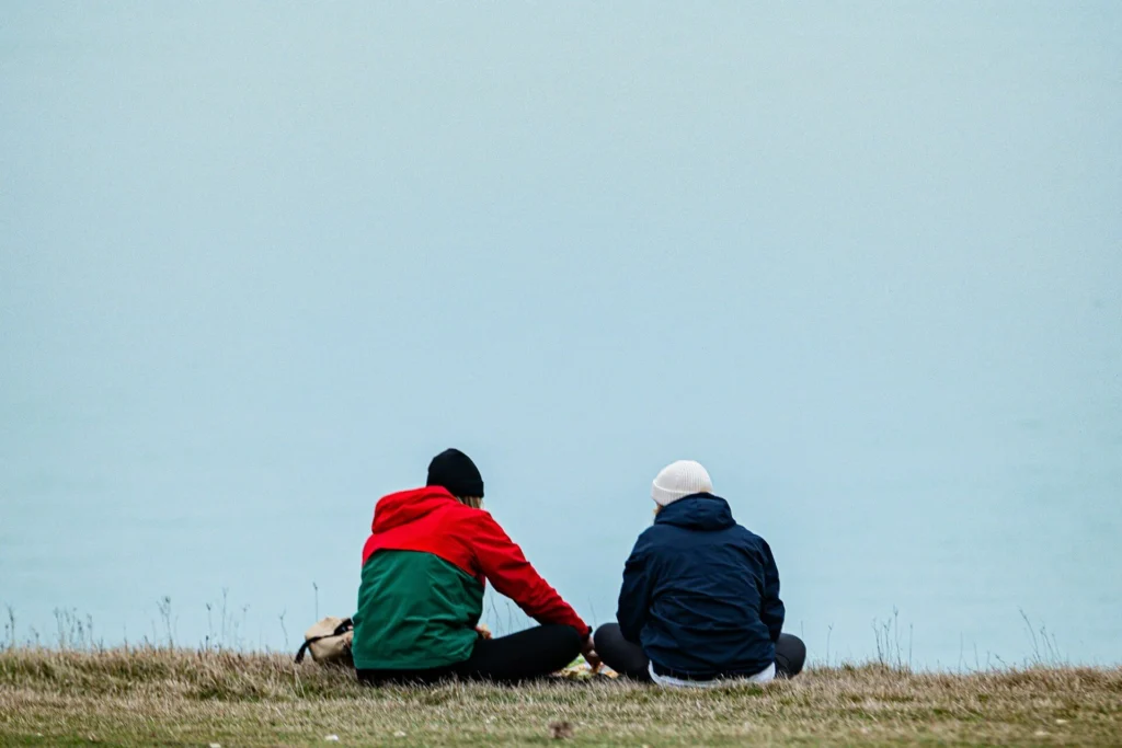 two friends having a quiet conversation