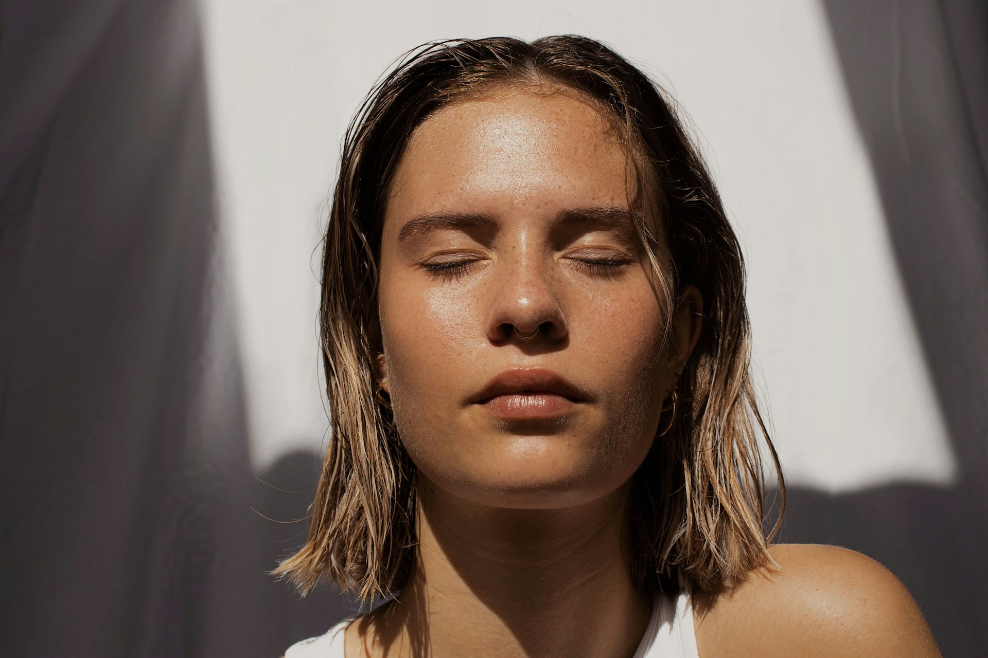 olive skin toned woman with eyes closed