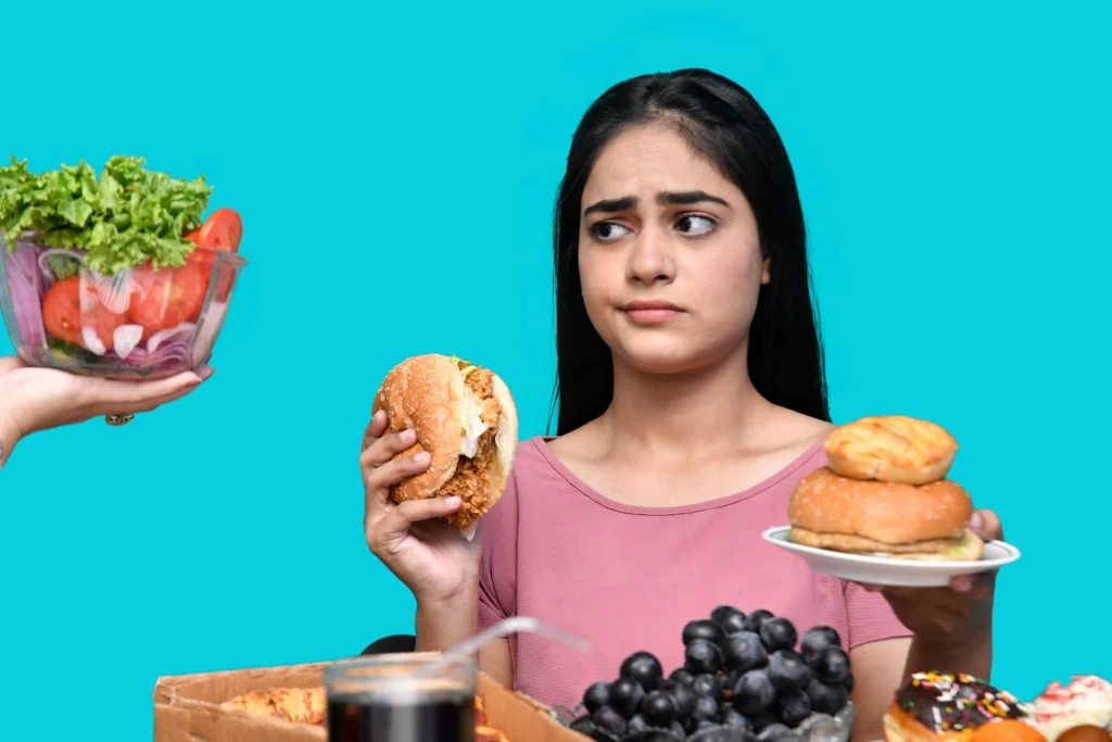 A woman surrounded by food with a confused look on her face