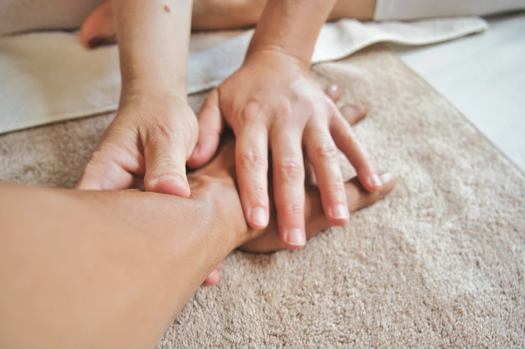 hand massage on brown towel