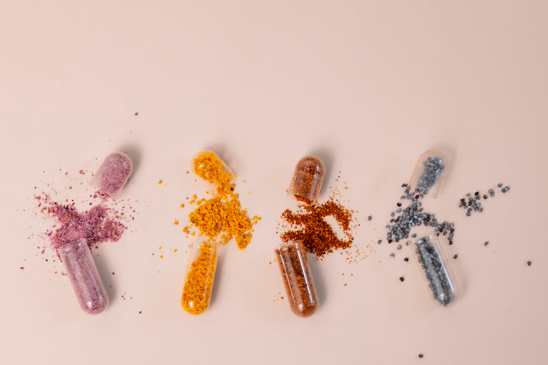 different colored capsules split open