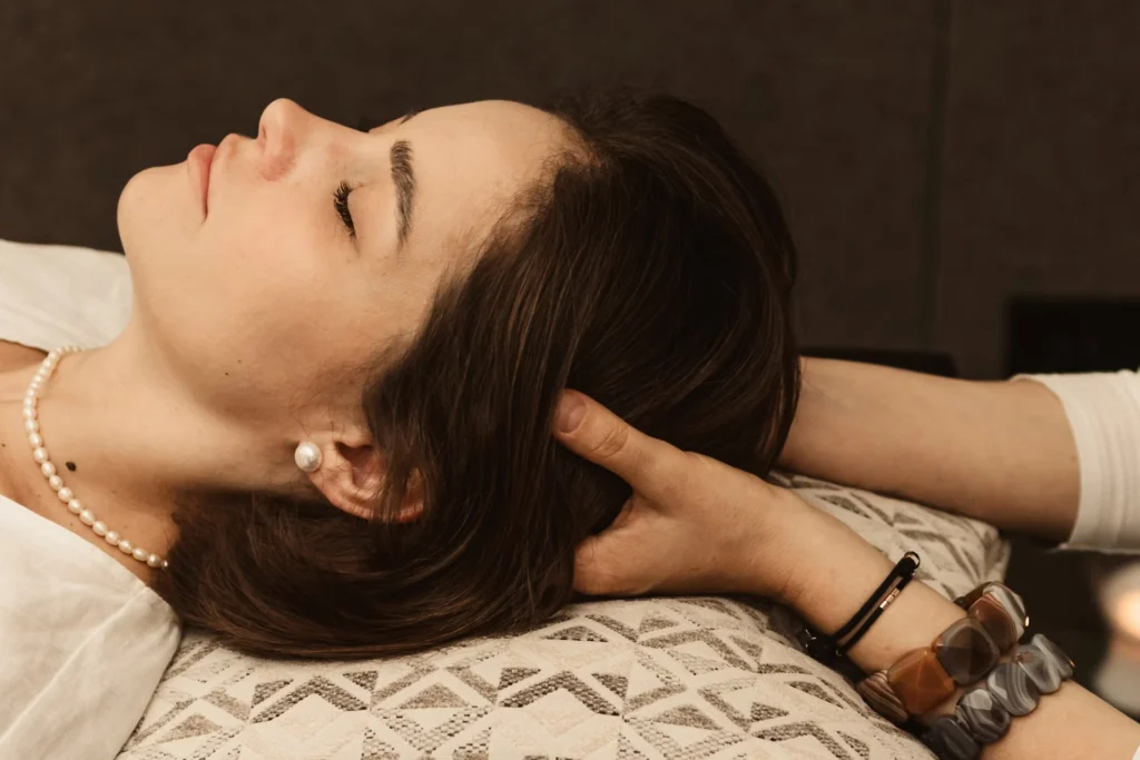 woman enjoying touch from another under scalp