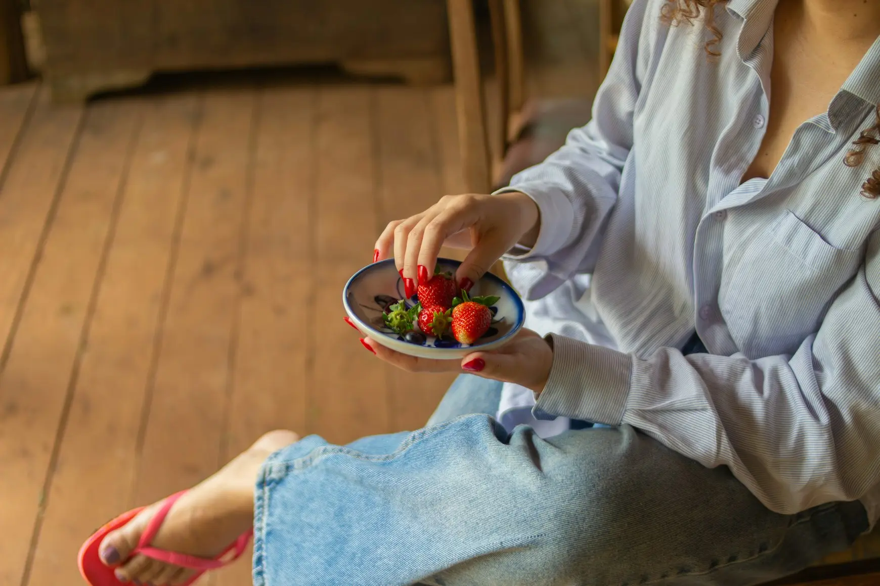 woman eating strawberries