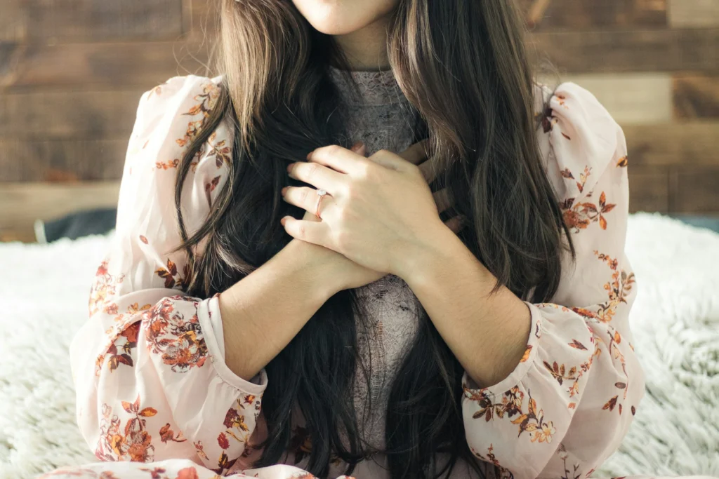 woman in white red floral long sleeve shirt