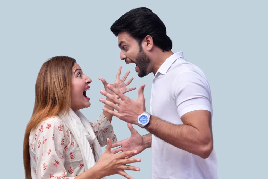 man and woman face-to-face and arguing