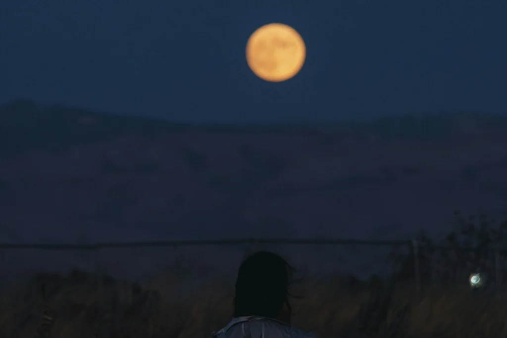 woman looking at the moon