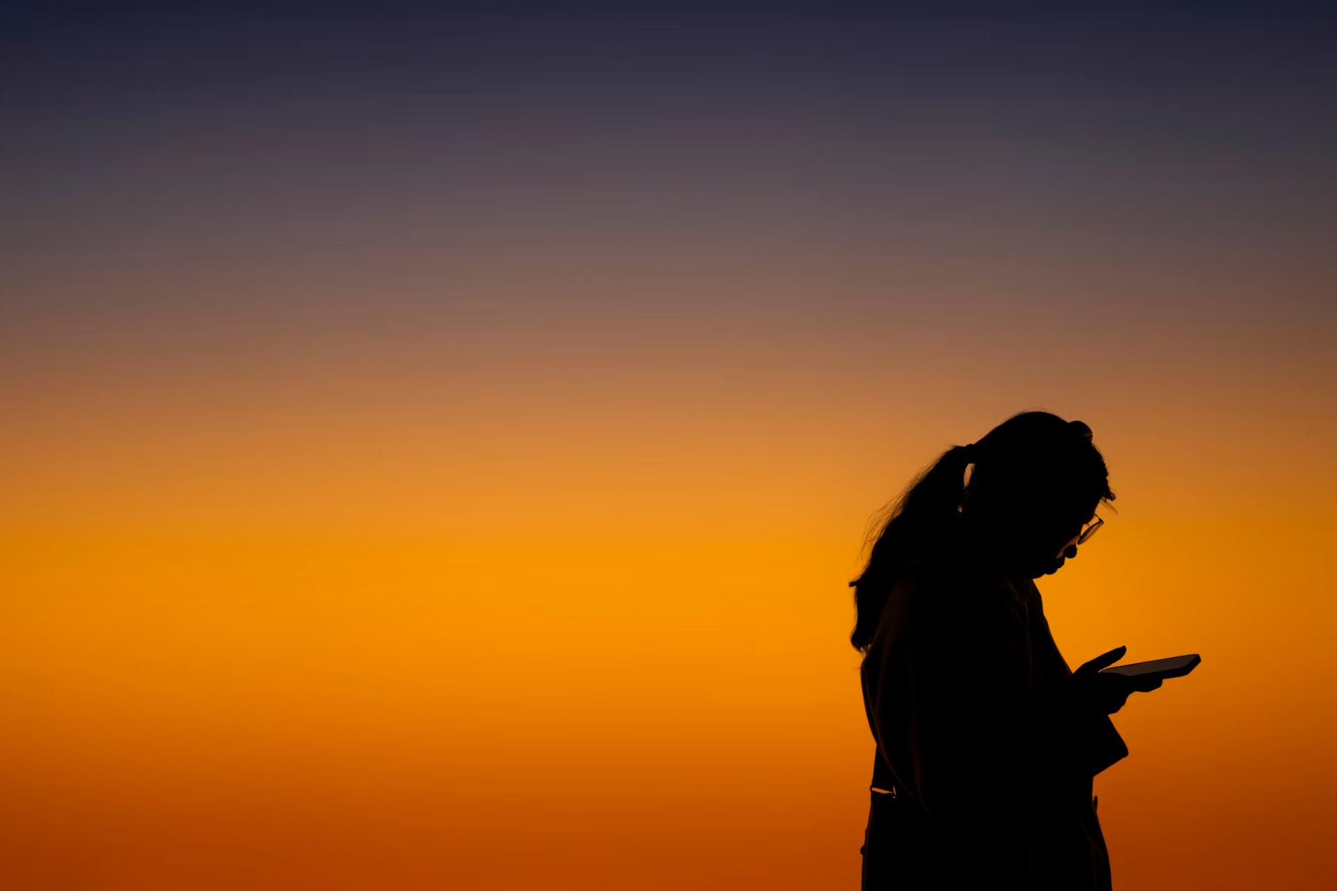 silhouette of woman on phone
