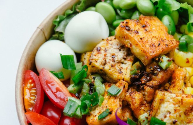 bowl of salad with chicken eggs and tomatoes but is everyplate healthy