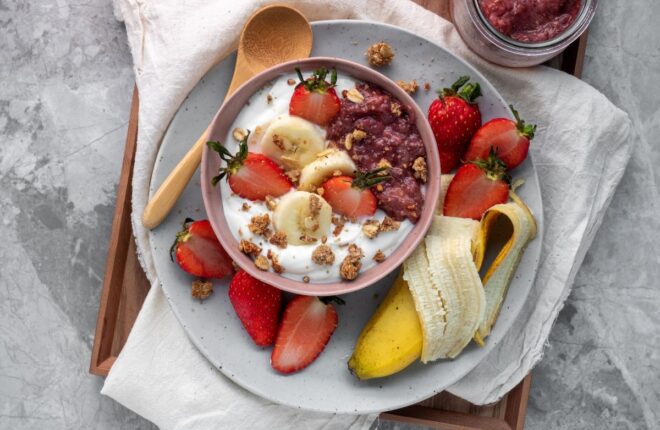 a yogurt bowl with a side of banana two great gut healthy foods
