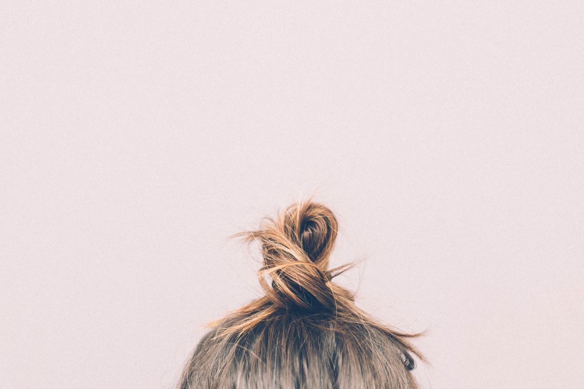 woman's bun that needs the best shampoo for thinning hair