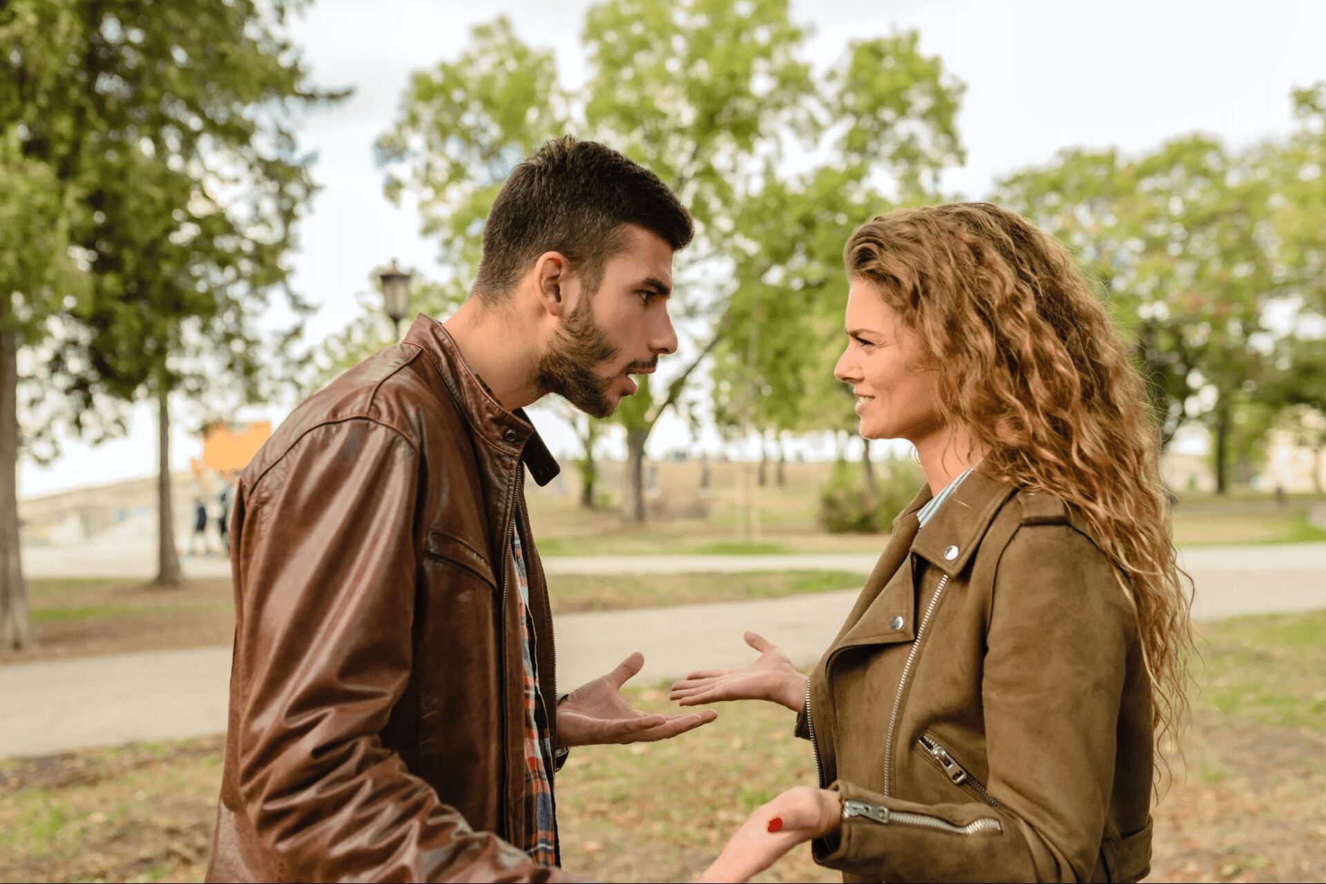 a couple expressing anger while outdoors