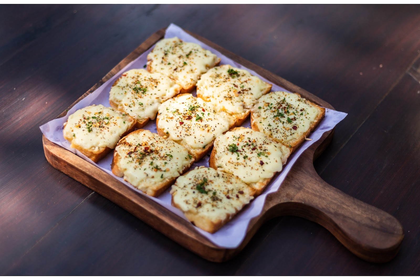 Garlic cheese toast on a wooden tray - breakfast ideas without eggs