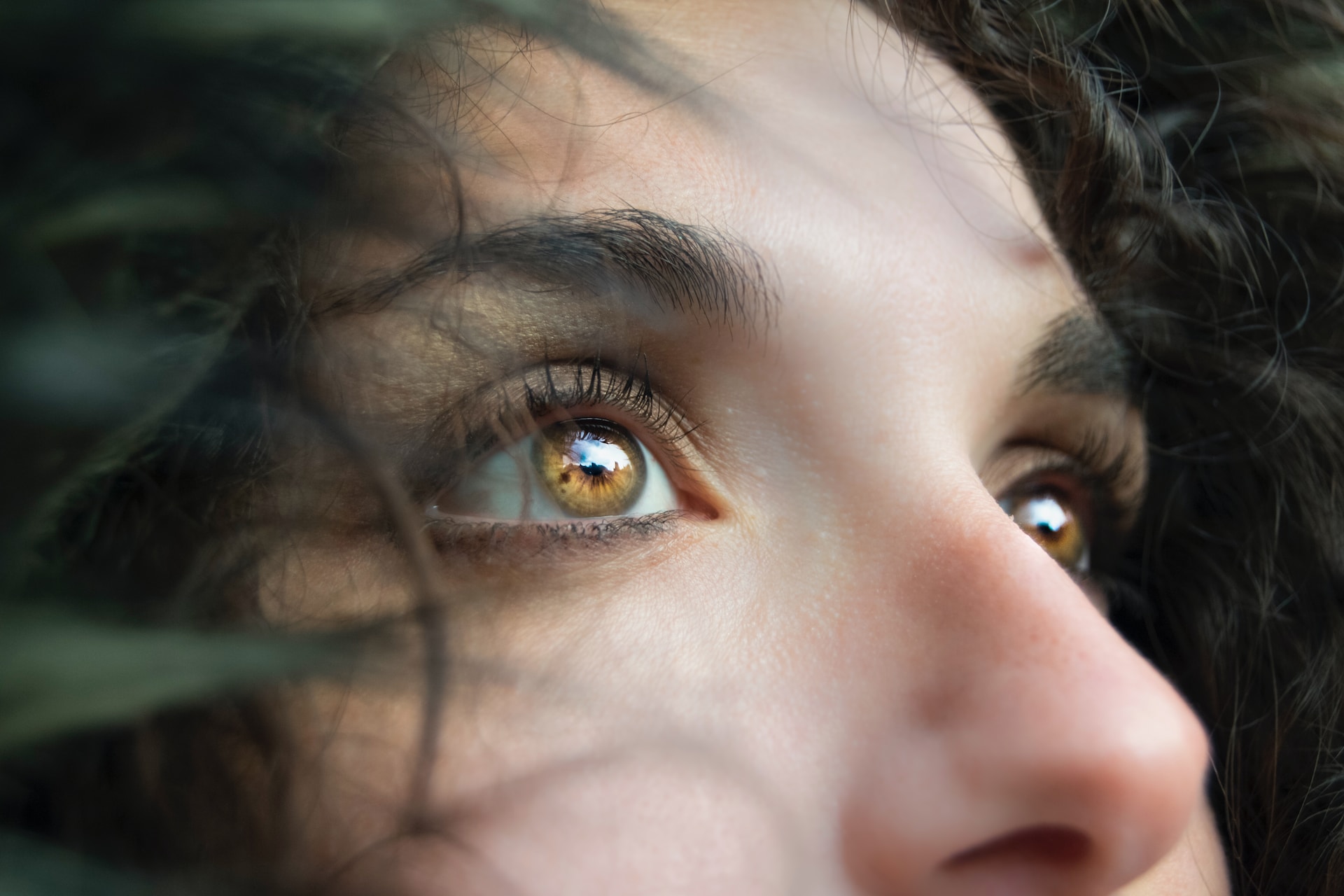 woman with hazel eyes looking into the distance