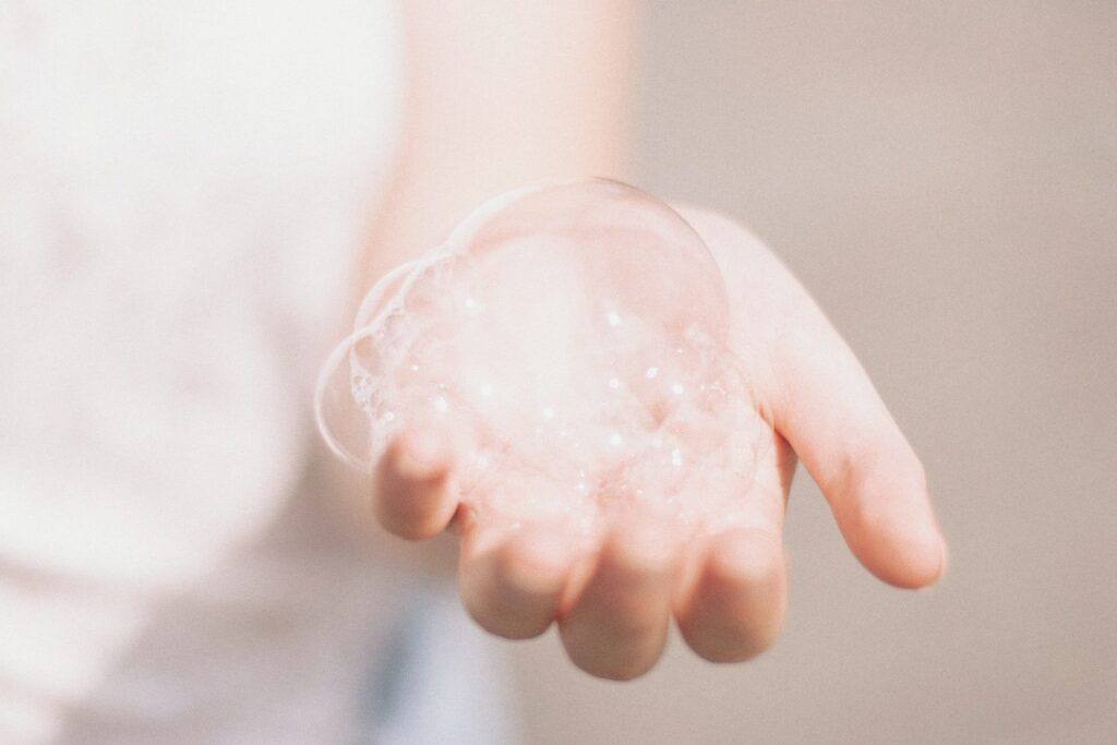 Hand with soap bubbles - how to get hair dye off skin