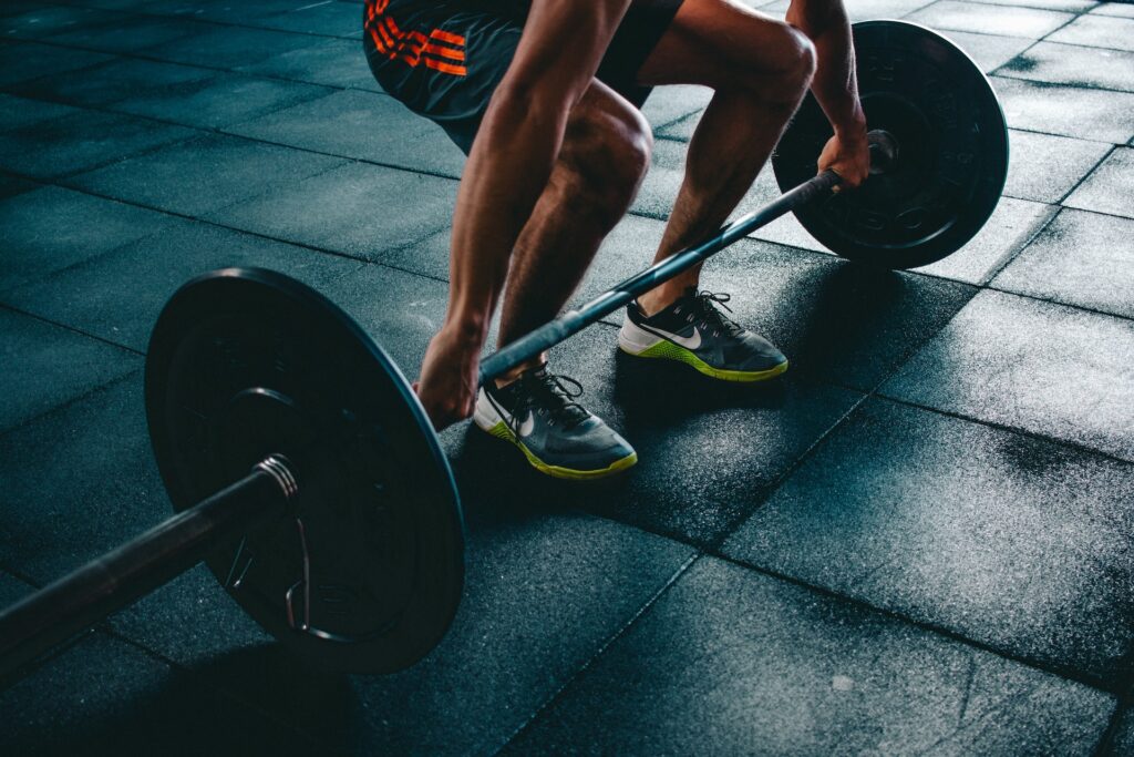 aerobic and anaerobic respiration - a man lifting weights