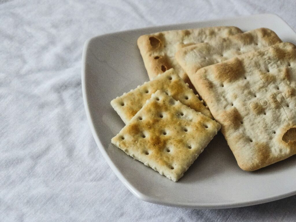 Salty crackers on a white plate.