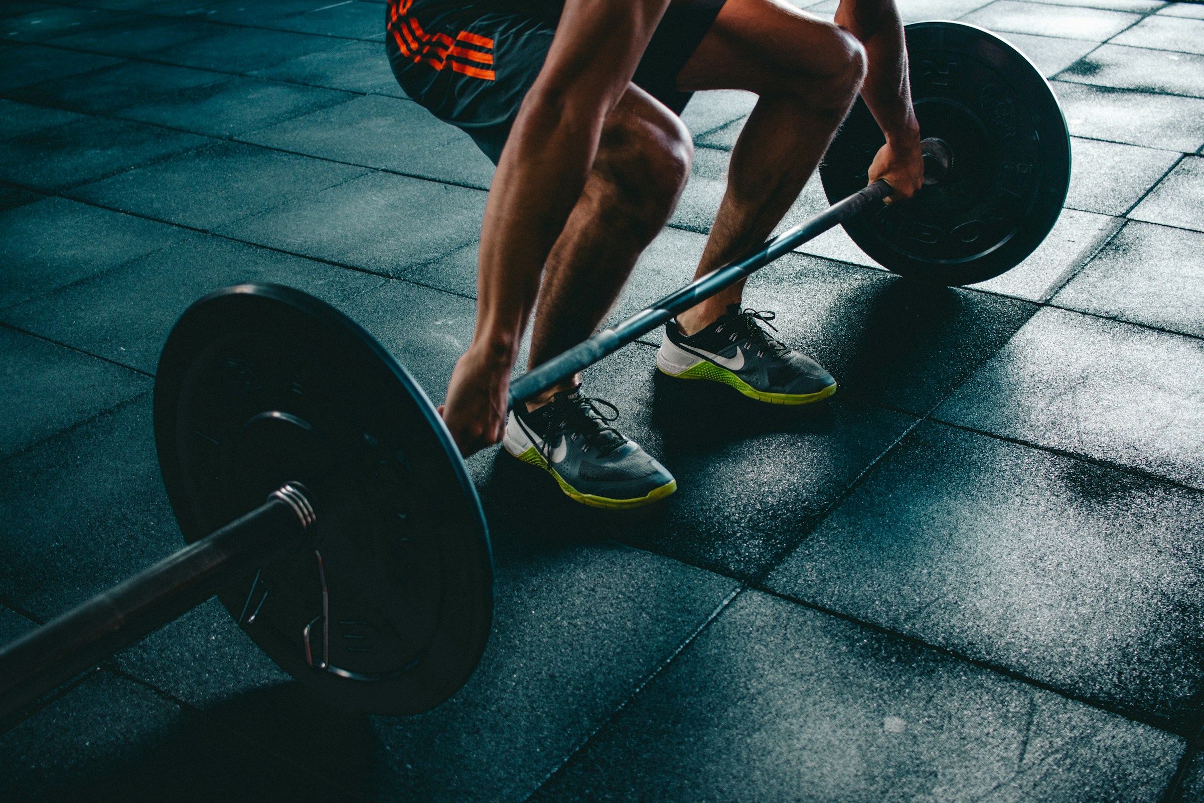 A man lifting weights in a gym