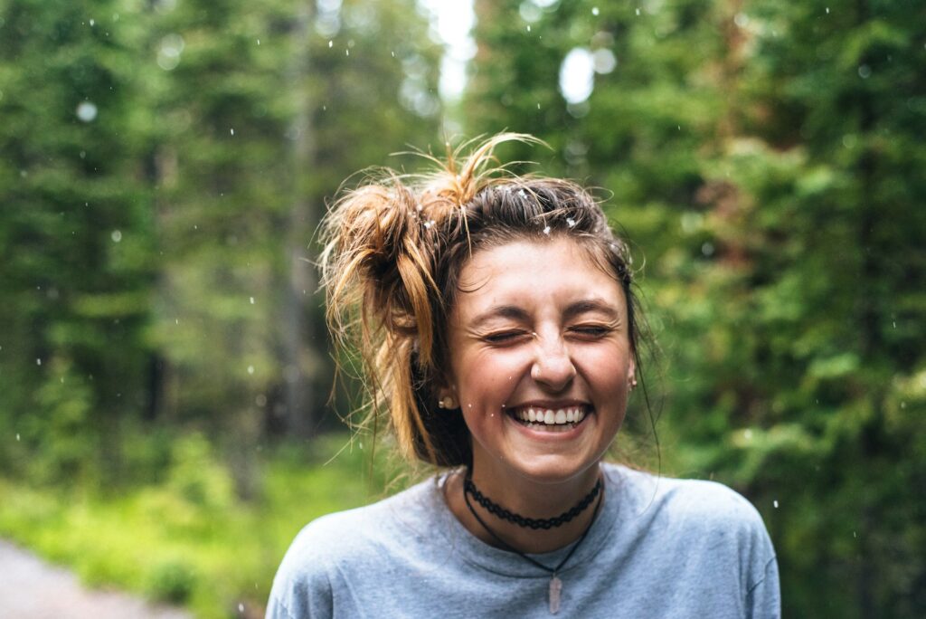 Woman Laughing in the Woods