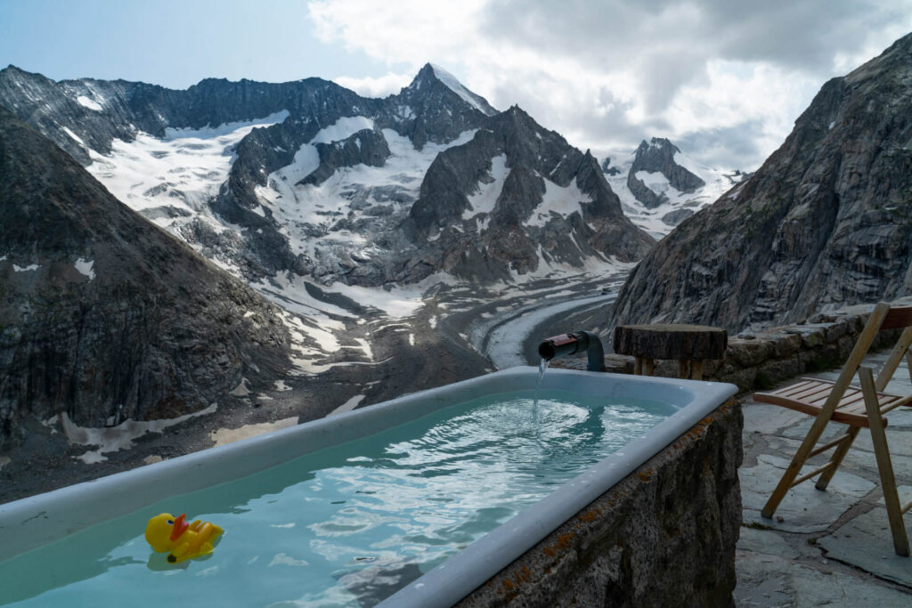 bath near mountains with rubber duck