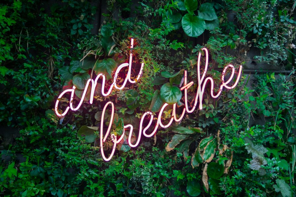 Neon Sign That Says And Breathe