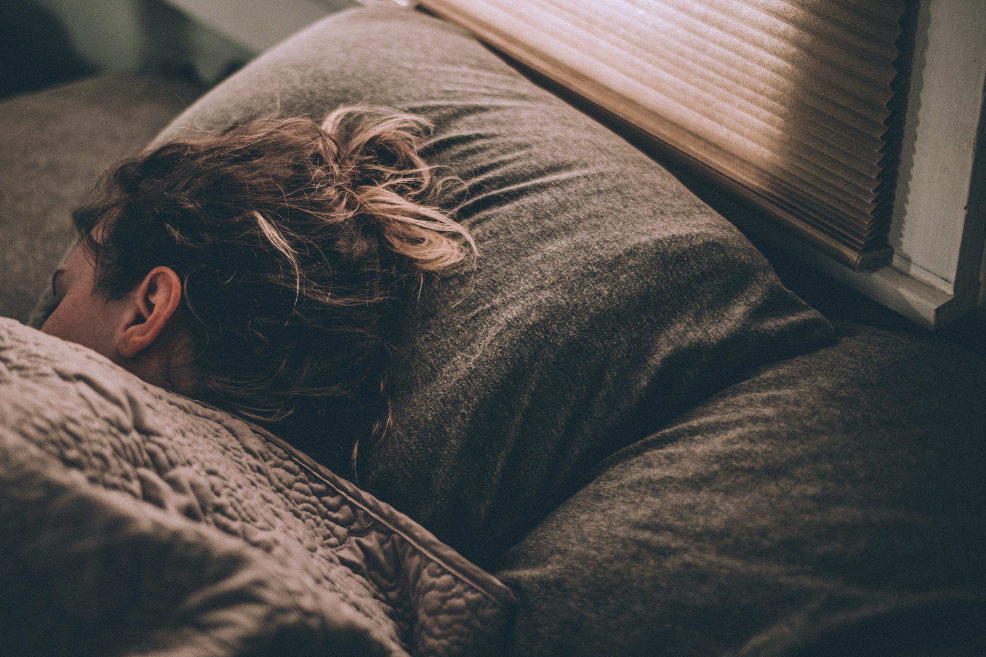 mouth tape for sleep - a woman sleeping