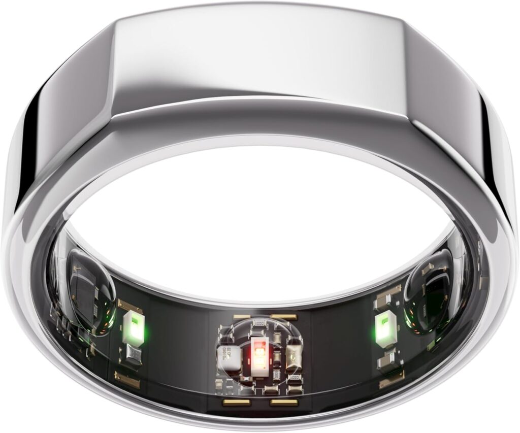 An Oura ring, the 3rd generation, sits against a white background. It's silver with bent edges.