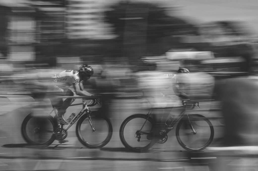 Two people cycling.