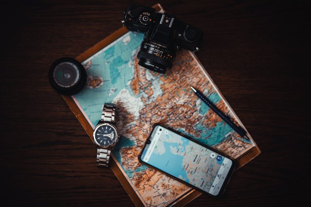 A watch, map, camera and phone