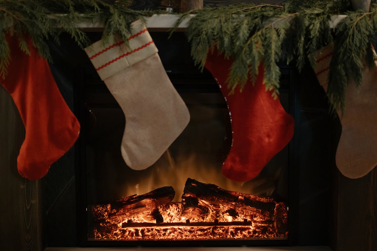 Four stockings hanging over a fireplace