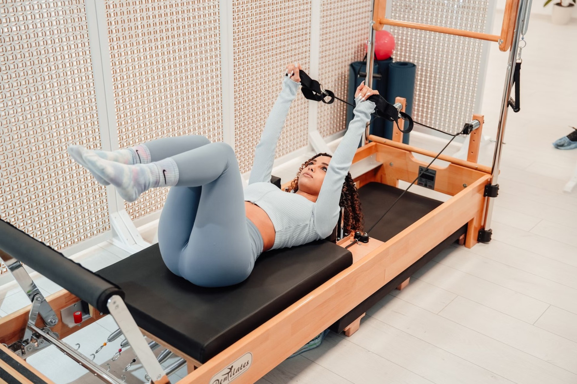 woman doing reformer Pilates