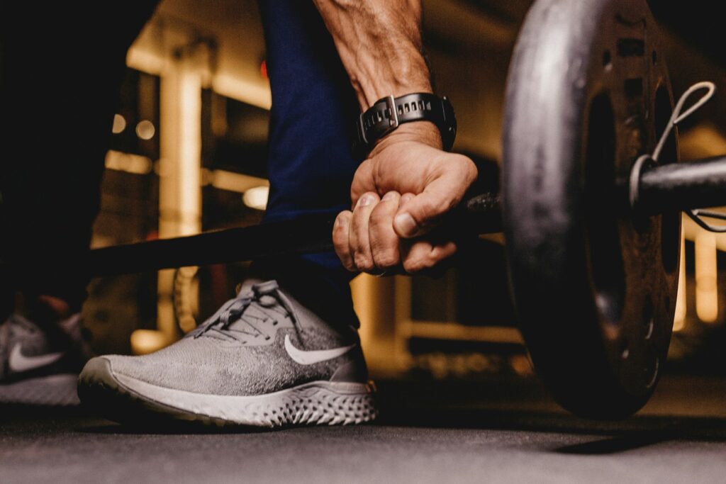 A man lifting a barbell.
