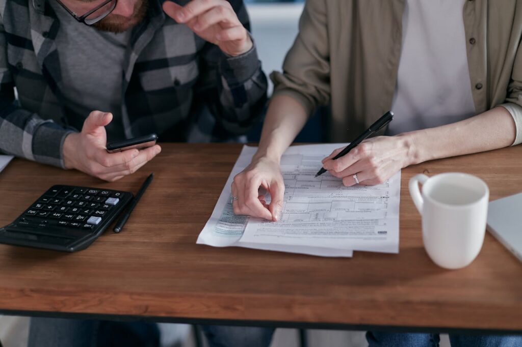 A couple discussing paperwork concerning financial matters 