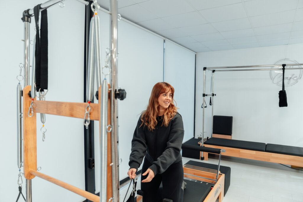 A girl on a reformer.