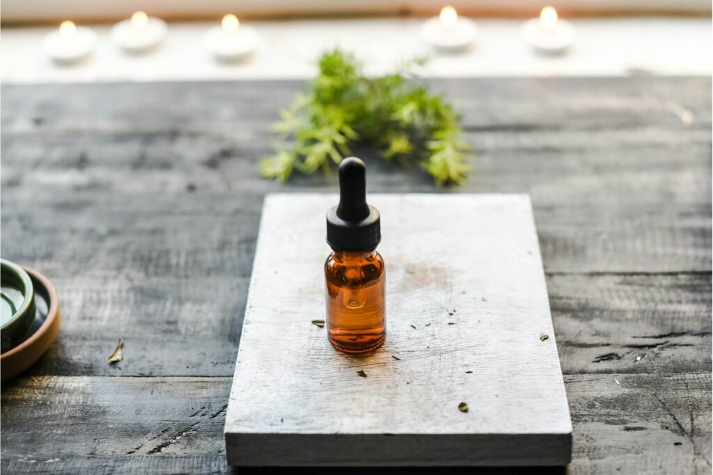 A castor oil bottle on a wooden slab