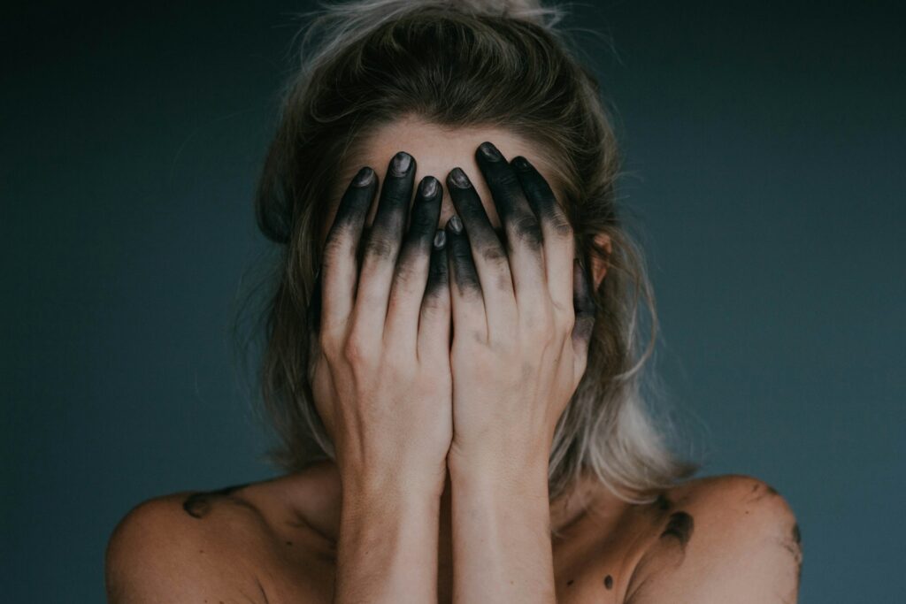 A woman feeling guilty for resting.
