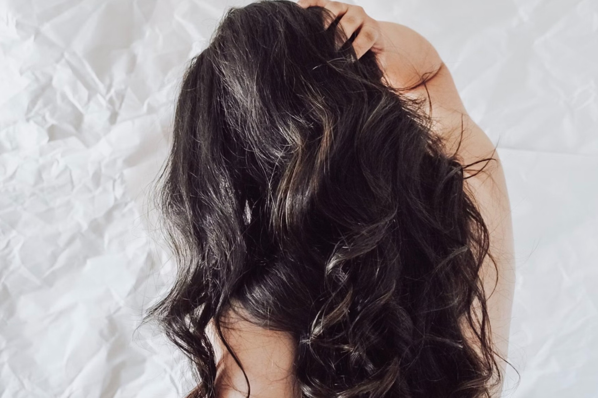 girl scratching scalp